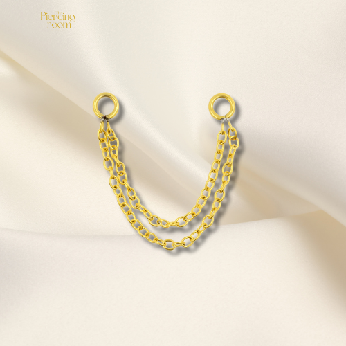 Double Layer Piercing Chain in goudkleurig chirurgisch staal. Twee lagen ketting, geschikt voor click rings, studs en piercingstaafjes tot 1,6 mm.