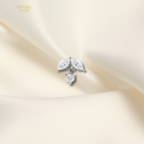 Zilverkleurige threadless top van nikkelvrij staal met marquise-geslepen zirconia hanger. Luxe en glanzend design, geschikt voor diverse piercings.